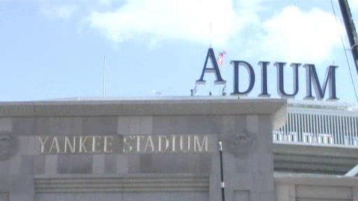 Frame grab of an MLB.com video, showing workers lowering the ‘A’ into position to the left of ‘DIUM’, forming a temporary ‘ADIUM’.